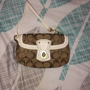 Small tan and white Coach wristlet